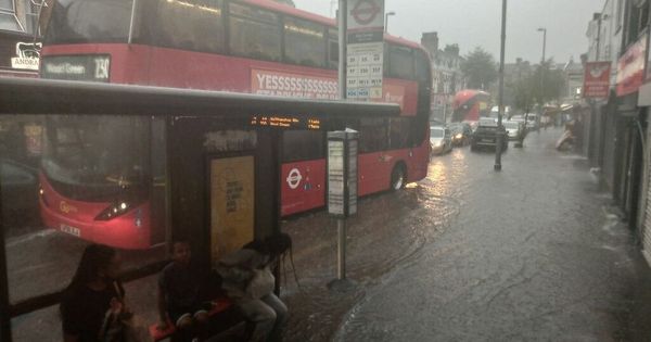 Flash floods in London see families stranded and whole stations plunged underwater