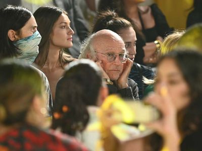 Larry David has explained why he was plugging his ears at New York Fashion Week