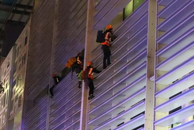 Animal Rebellion protesters scale government building in climate change protest