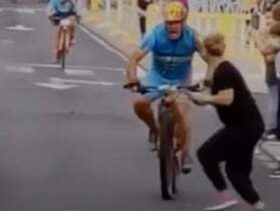 Cyclist smashes into woman on phone as he races towards finish line