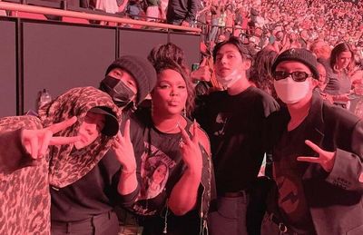 BTS and Lizzo pose for iconic selfies at Harry Styles concert and fans are obsessed