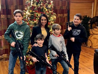 A second Republican has shared a Christmas picture with kids holding guns