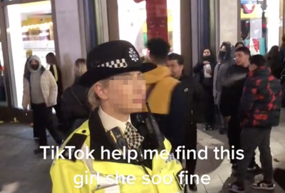 TikTok clip shows men catcalling a police officer on busy street in disturbing trend