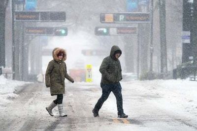 Tens of thousands without power as winter storm sweeps through south-east of US