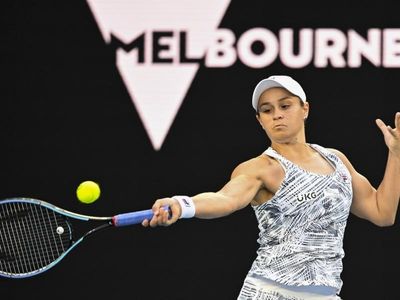 Barty charges into Open second round