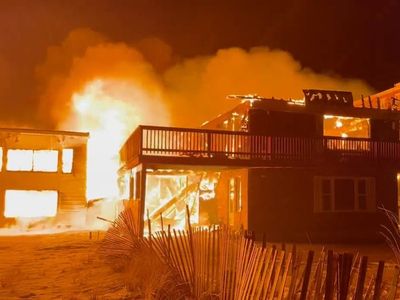 Massachusetts motel fire spreads to nearby buildings