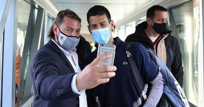 Novak Djokovic takes selfies with fans and staff as he lands in Serbia to hero’s welcome