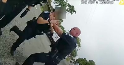 Police officer chokes female colleague by grabbing her neck during arrest in footage