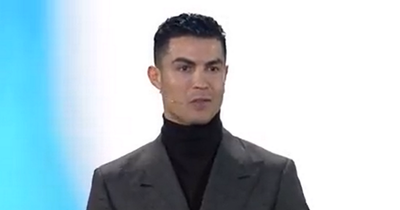 Manchester United's Cristiano Ronaldo reacts to winning two FIFA Best awards