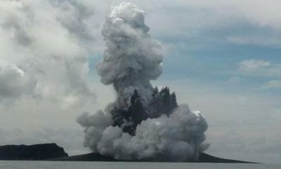 Tonga volcano: distress signal detected in low-lying islands after eruption, as first death reported