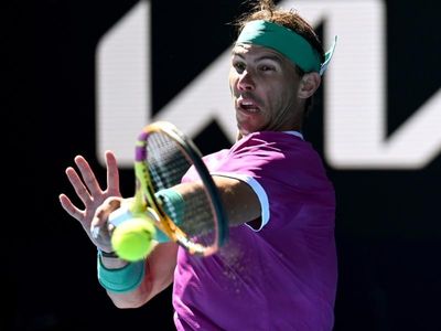 Nadal grinds into Open's third round