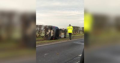 Formby Bypass shut after Ford Focus rolls on to its side