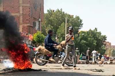 Sudanese barricade streets after 7 killed in anti-coup protests