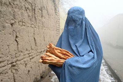 Desperate Afghans queue for free bread as poverty crisis deepens