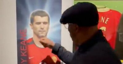 Arsenal hero Ian Wright punches picture of Roy Keane during tour of Man Utd stadium