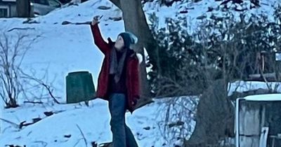 Woman takes selfie on top of sinking car after crashing through ice of frozen river