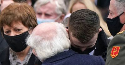 Poignant moment President Michael D. Higgins comforts Ashling Murphy's family and boyfriend at funeral