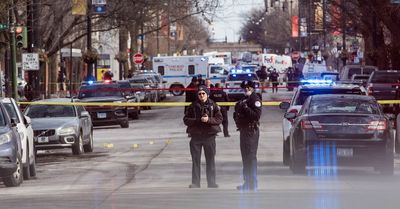Bodycam video shows University of Chicago police officer firing across street at gunman while yelling at him to get on the ground