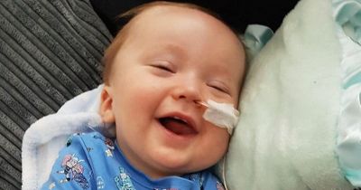 The smiley little boy who touched people’s hearts dies from rare disease as hundreds line the streets for funeral