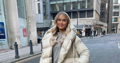 Molly-Mae swamped by enormous puffer jacket as she strolls around chilly Manchester