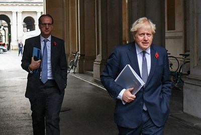 UK PM aims to relax COVID rules amid threat to position