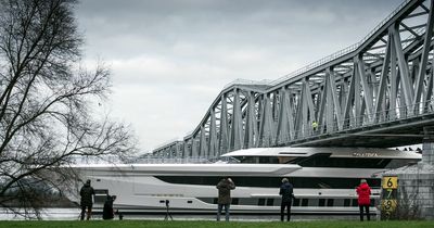 Incredible moment enormous super-yacht scrapes under bridge with inches to spare