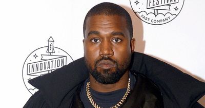 Kanye West wears full face-covering mask to meet business associates