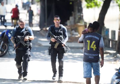 Rio police occupy favelas in new push to combat gangs