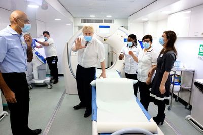 UK lifts COVID restrictions, says omicron wave 'has peaked'