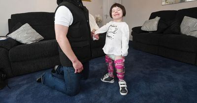 "Little miracle" Ella returns home after pioneering surgery that saw her take her first steps
