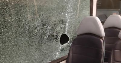 Rock hurled at bus window with scared passengers on board