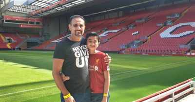 Liverpool fan and son escorted to safety after confronting Brentford group over racist chants