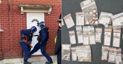 Two arrested after police seize drugs and cash in Trafford raid