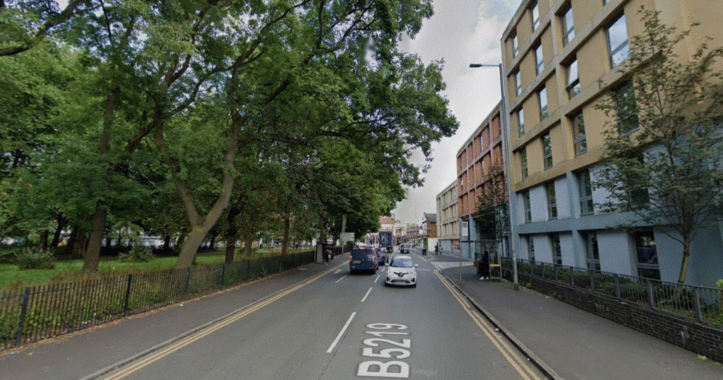 Armed cops swoop on car outside Manchester park as two men arrested