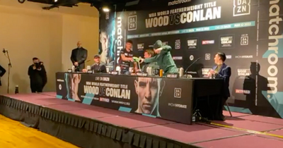 Leigh Wood tosses away Michael Conlan signed glove during press conference