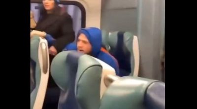 Pair charged with hate crimes for abusing woman on New York train after being caught in viral video