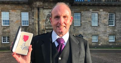 Dumfries businessman finally receives MBE at Palace of Holyroodhouse