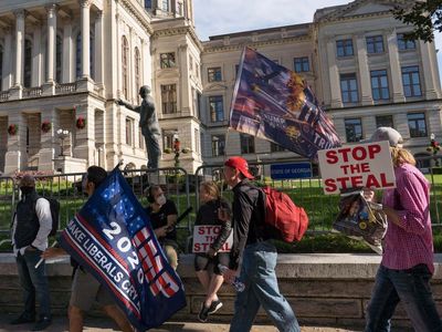 Justice Department charges Texas man over threat to ‘put a bullet’ in Georgia election officials