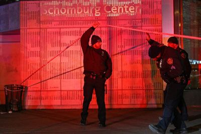 One NYPD officer fatally shot and another wounded in Harlem