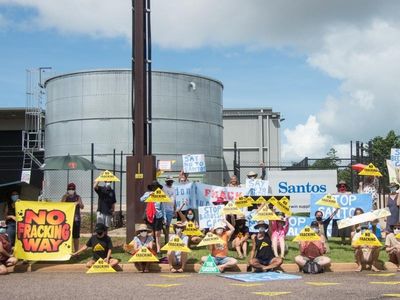 Protesters rally in Darwin against Santos