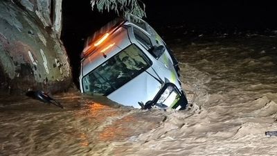 Floodwaters submerge parts of outback SA as rain washes away highway and cars