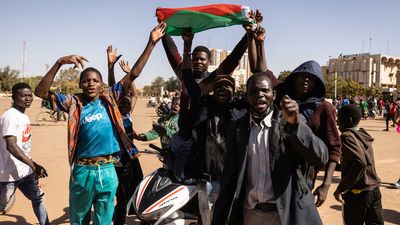 Shots heard near Burkina Faso president's home, protesters torch ruling party HQ