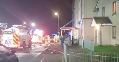 Woman rushed to hospital after ‘deliberate’ blaze at Scots flats as cops hunt firebugs