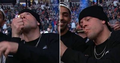 Nate Diaz lights joint while cageside for Francis Ngannou vs Ciryl Gane