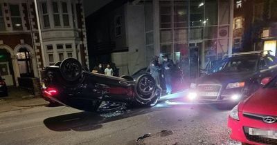 Car flips and lands on its roof after crash in Cardiff in the early hours of the morning