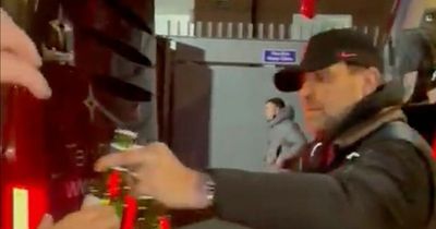 Jurgen Klopp passes beers to Liverpool fans from team bus after Crystal Palace win