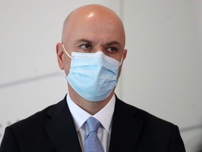 Qld hospitals 'bearing' flatter virus wave
