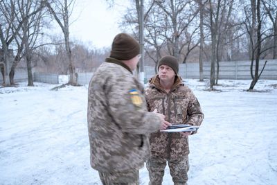 In a Ukrainian city near Russia, a civilian army prepares for war