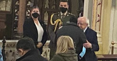 Poignant moment President Higgins embraces heartbroken husband of murdered mum at memorial mass