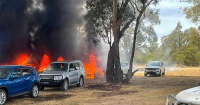 Horses and jockeys evacuated from track as huge fire breaks out just before race